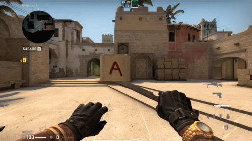 A Person Is Holding A Sword In Front Of A Block That Says A On It GIF