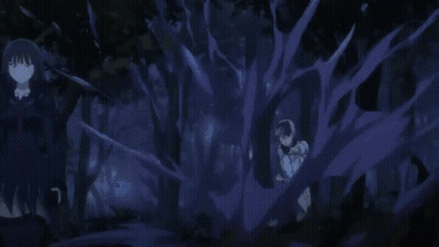 A Person Is Holding A Sword In Their Hand In A Dark Room . GIF