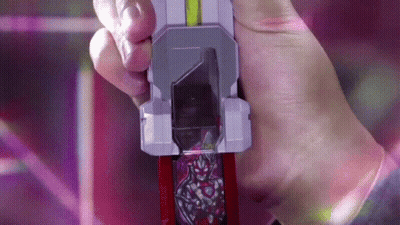 A Person Is Holding A Toy In Their Hand That Looks Like A Knife GIF
