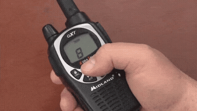 A Person Is Holding A Walkie Talkie That Says Gxt On The Front GIF