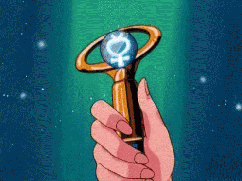 A Person Is Holding A Wand With A Female Symbol On It In Their Hand . GIF