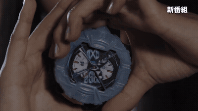 A Person Is Holding A Watch That Says Texu On The Face GIF