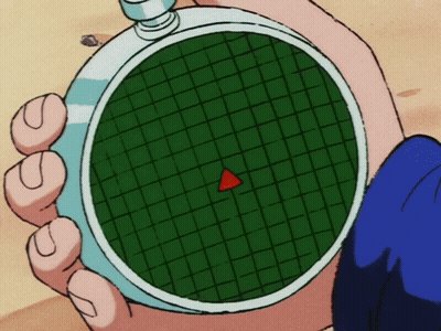 A Person Is Holding A Watch With A Red Triangle In The Center GIF