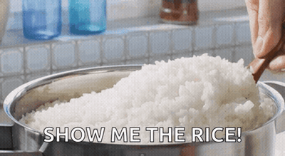 A Person Is Holding A Wooden Spoon Over A Pot Of Rice With The Words Show Me The Rice Behind Them GIF