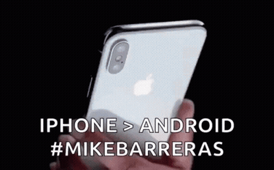 a person is holding an iphone in their hand with the words iphone > android #mikebarrieras written on it .