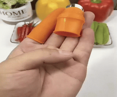 A Person Is Holding An Orange Object In Their Hand In Front Of A Potted Plant That Says Home GIF