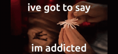 A Person Is Holding Something In Their Hands With The Words Ive Got To Say Im Addicted GIF