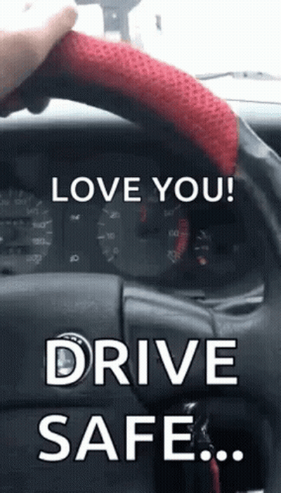 A Person Is Holding The Steering Wheel Of A Car With The Words `` Love You ! Drive Safe . '' GIF
