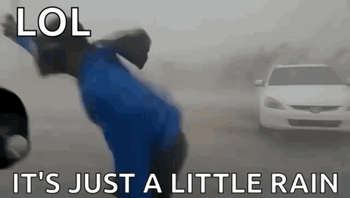 A Person Is Jumping In The Air In Front Of A White Car . GIF