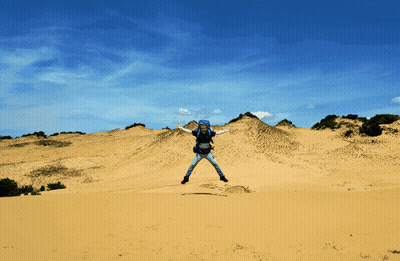 A Person Is Jumping In The Air While Wearing A Blue Helmet GIF