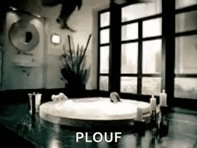 A Person Is Jumping Into A Bathtub In A Bathroom With A Sign That Says Plouf . GIF