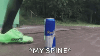 A Person Is Kicking A Can Of Red Bull In The Air GIF
