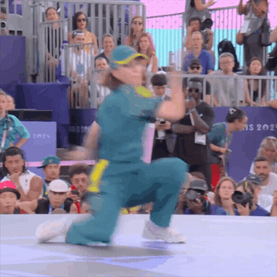 A Person Is Kneeling Down In Front Of A Sign That Says Ns 2021 GIF