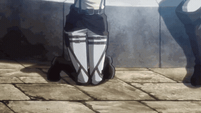A Person Is Kneeling Down With Their Legs Crossed In Front Of A Wall With The Letters Sbs Visible GIF