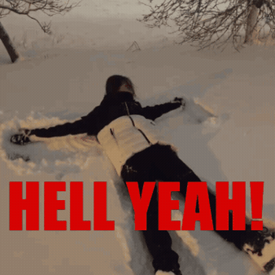 A Person Is Laying In The Snow With The Words Hell Yeah Written In Red GIF