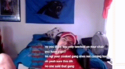 A Person Is Laying On A Bed With A Black Panther On A Wall Behind Them GIF