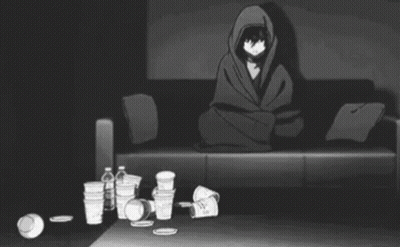 A Person Is Laying On A Couch In A Living Room With A Lot Of Trash On The Floor . GIF