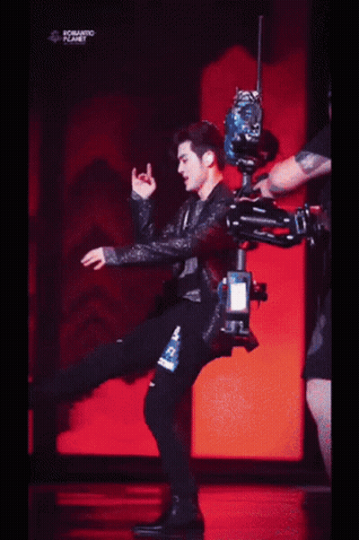 A Person Is Laying On A Red Surface With The Words Romantic Planet Written On The Bottom . GIF