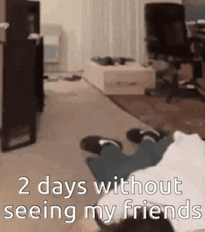 A Person Is Laying On The Floor In A Living Room With The Words 2 Days Without Seeing My Friends GIF