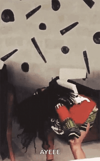 A Person Is Laying On Their Back With A Bunch Of Objects Falling On Them And Says Ayeee . GIF