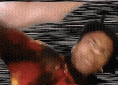 A Person Is Laying On Their Back With Their Arms Outstretched And A Blurry Background . GIF