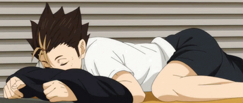 A Person Is Laying On Their Stomach With Their Head On A Pillow GIF