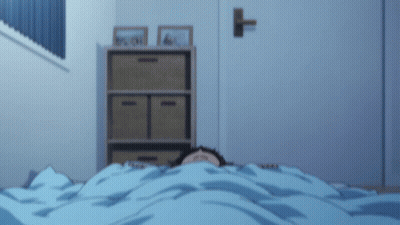 A Person Is Laying Under A Blue Blanket With Their Eyes Closed GIF