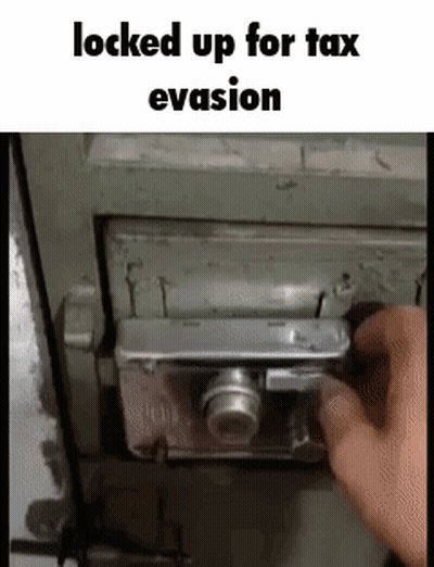 A Person Is Locking Up A Safe With A Camera Lock . GIF