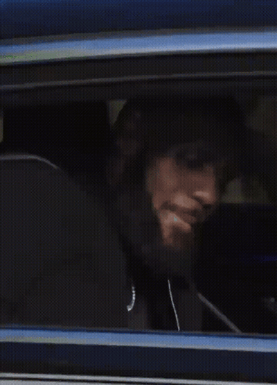 A Person Is Looking Out Of A Window Of A Car GIF