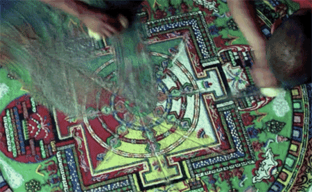 A Person Is Making A Colorful Mandala With The Letter L In The Middle GIF