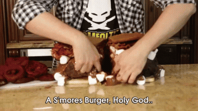 A Person Is Making A S'mores Burger With Marshmallows And Bacon GIF