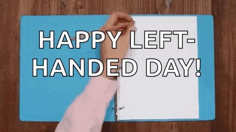 A Person Is Opening A Blue Binder With The Words `` Happy Left-Handed Day ! '' GIF