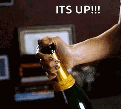 A Person Is Opening A Bottle Of Champagne And The Caption Says It 'S Up GIF