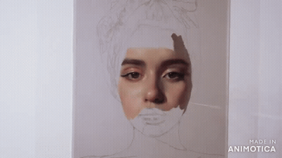 A Person Is Painting A Portrait Of A Woman With A Brush . GIF