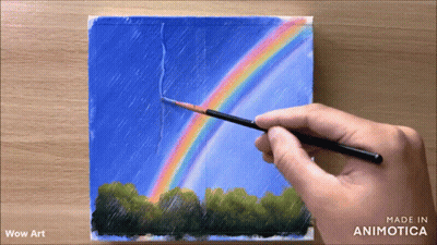 A Person Is Painting A Rainbow With A Brush On A Piece Of Paper That Says Wow Art GIF