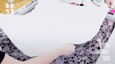 A Person Is Painting On A Piece Of Paper With The Word Be On The Bottom GIF