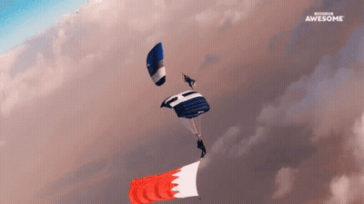 A Person Is Parachuting With A Banner That Says " Awesome " GIF