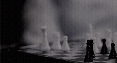 A Person Is Playing A Game Of Chess With Their Fingers . GIF