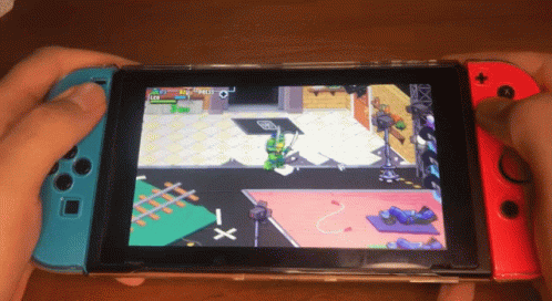 A Person Is Playing A Game On A Nintendo Switch With A Turtle On The Screen GIF