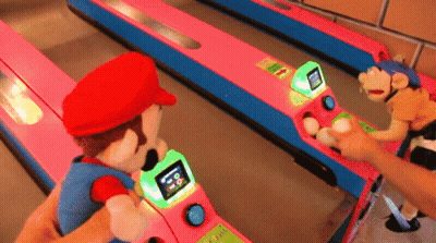 A Person Is Playing A Game With Mario And A Monkey GIF