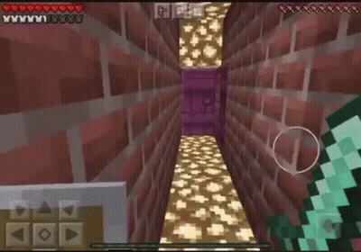 A Person Is Playing A Video Game Called Minecraft On Their Phone GIF
