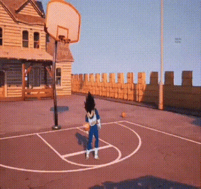 A Person Is Playing Basketball On A Court In Front Of A Building . GIF