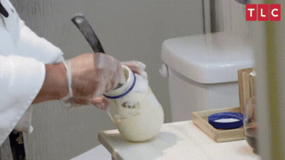 A Person Is Pouring Something Into A Jar With Tlc Written On The Top GIF