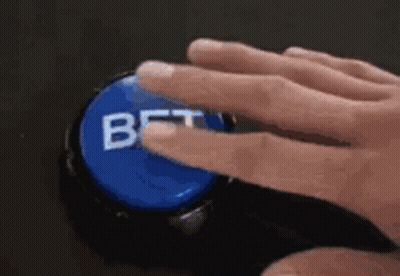 A Person Is Pressing A Bet Button With Their Finger . GIF