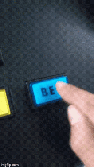 A Person Is Pressing A Blue Be Button With Their Finger GIF