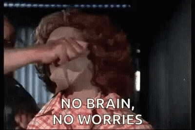 A Person Is Putting A Mask On Another Person 'S Face . GIF