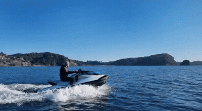 A Person Is Riding A Jet Ski In The Water GIF