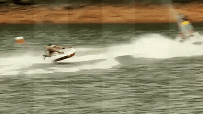 A Person Is Riding A Jet Ski On A Body Of Water . GIF