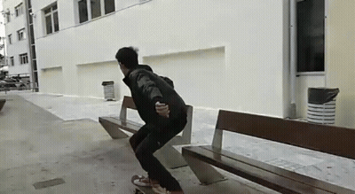 A Person Is Riding A Skateboard On A Bench GIF