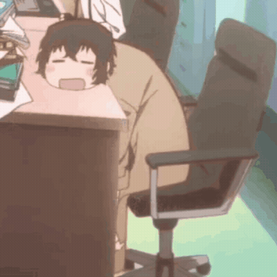 A Person Is Sitting At A Desk With Their Head On A Desk . GIF
